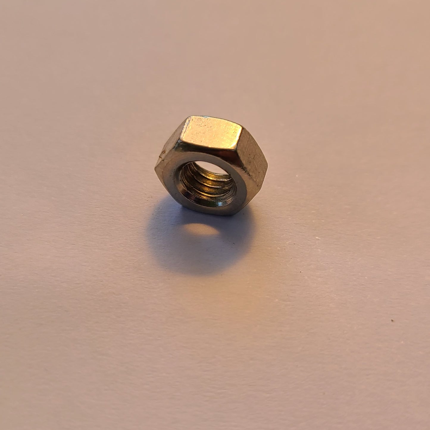 M6 x 1.0 steel hex nut.